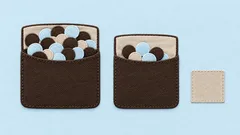 Two cloth pockets holding unequal groups of stitched tokens and a separate fabric swatch.